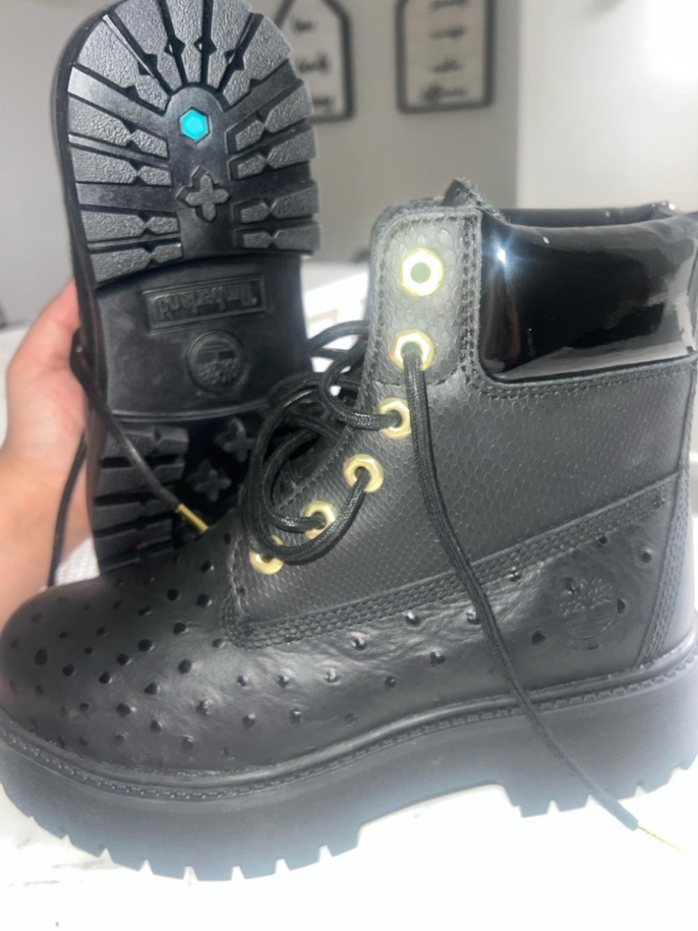 Timberland Black Leather Perforated Lug Boots with Gold Eyelets